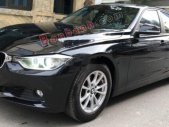 BMW 3 Series 320i 2012 - Cần bán xe BMW 320i sản xuất 2012, model 2013 màu đen giá 720 triệu tại Hà Nội