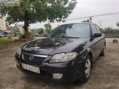 Mazda 323 2002 - Cần bán lại xe Mazda 323 sản xuất 2002, màu đen xe nguyên bản giá 115 triệu tại Cao Bằng