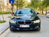 BMW 3 Series 320i 2014 - Bán xe BMW 3 Series 320i sản xuất năm 2014, màu đen, xe nhập, 850 triệu giá 850 triệu tại Hà Nội
