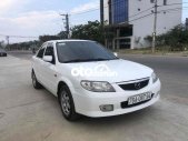 Mazda 323 2004 - Cần bán lại xe Mazda 323 sản xuất năm 2004, màu trắng giá 135 triệu tại Quảng Nam