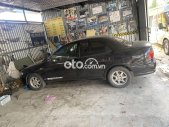 Mazda 323 1999 - Màu đen giá 87 triệu tại Bình Định