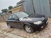 Mazda 323 Bán xe   màu đen, sx 2002. 2002 - Bán xe Mazda 323 màu đen, sx 2002. giá 93 triệu tại Hải Dương