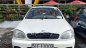 Daewoo Lanos SX 2002 - Cần bán gấp Daewoo Lanos SX đời 2002, màu trắng xe gia đình  