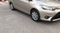 Toyota Vios   1.5 E  2015 - Cần bán Toyota Vios 1.5 E 2015, màu vàng